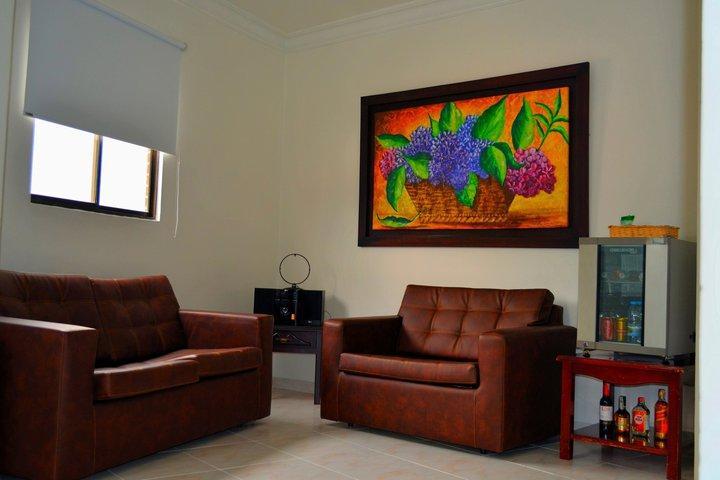 莫拉莱斯国际酒店及会议中心 Ibagué 外观 照片 A living room with a sofa and armchair